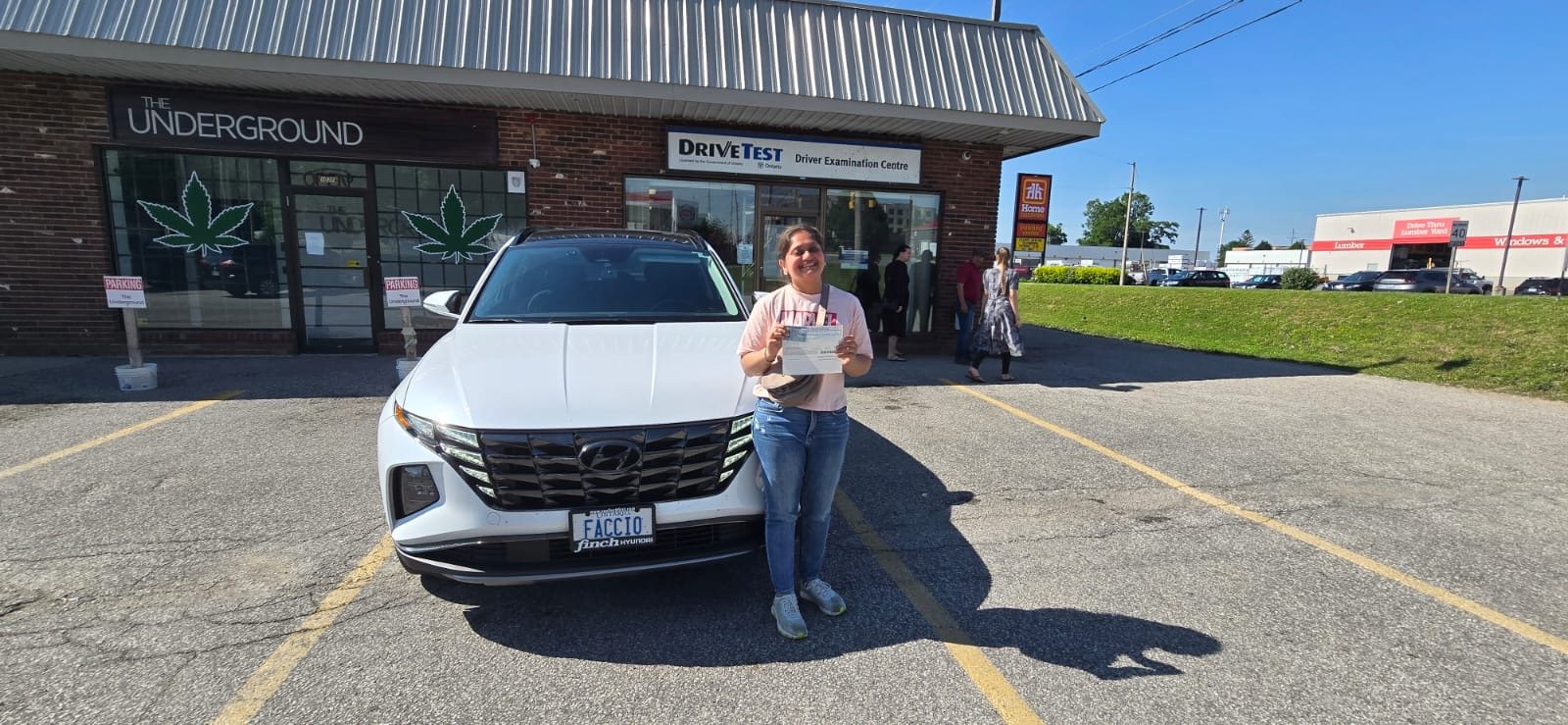Student celebrating outside an Ontario DriveTest centre